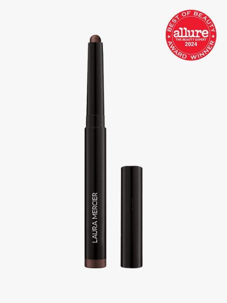 An open stick of Laura Mercier Caviar Stick Eyeshadow in Cocoa on light gray background with red 2024 Allure Best of Beauty Award winner seal
