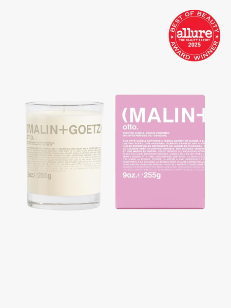 Malin + Goetz Otto Candle in branded component on a light gray background