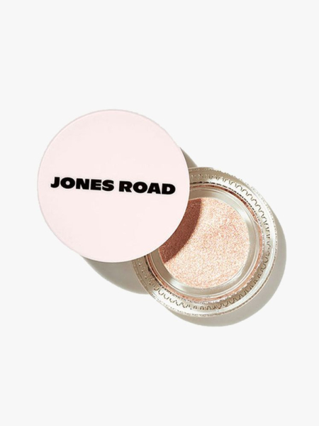 Jones Road Just A Sec jar of sparkly cream eyeshadow and light pink cap on light gray background